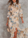 Abito Maxi Beige in Chiffon con Collo Alto, Stampa Floreale Effetto Dipinto a Olio e Orlo Asimmetrico