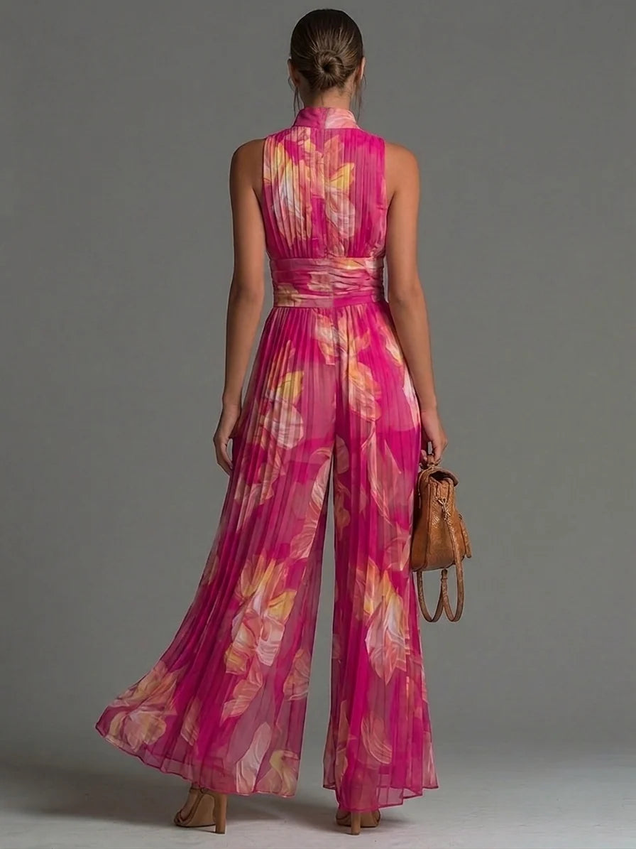 Tuta Fucsia Smanicata in Chiffon con Stampa Floreale, Pantaloni Plissettati a Gamba Larga e Chiusura con Cerniera